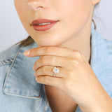 1/2 Carat Diamond Ring With Emerald Cut Centre Diamond Surrounded by Brilliant and Baguette Diamond Halo in Platinum