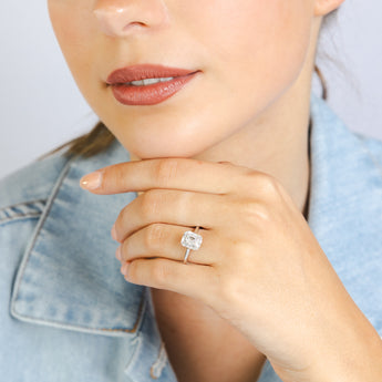 1/2 Carat Diamond Ring With Emerald Cut Centre Diamond Surrounded by Brilliant and Baguette Diamond Halo in Platinum