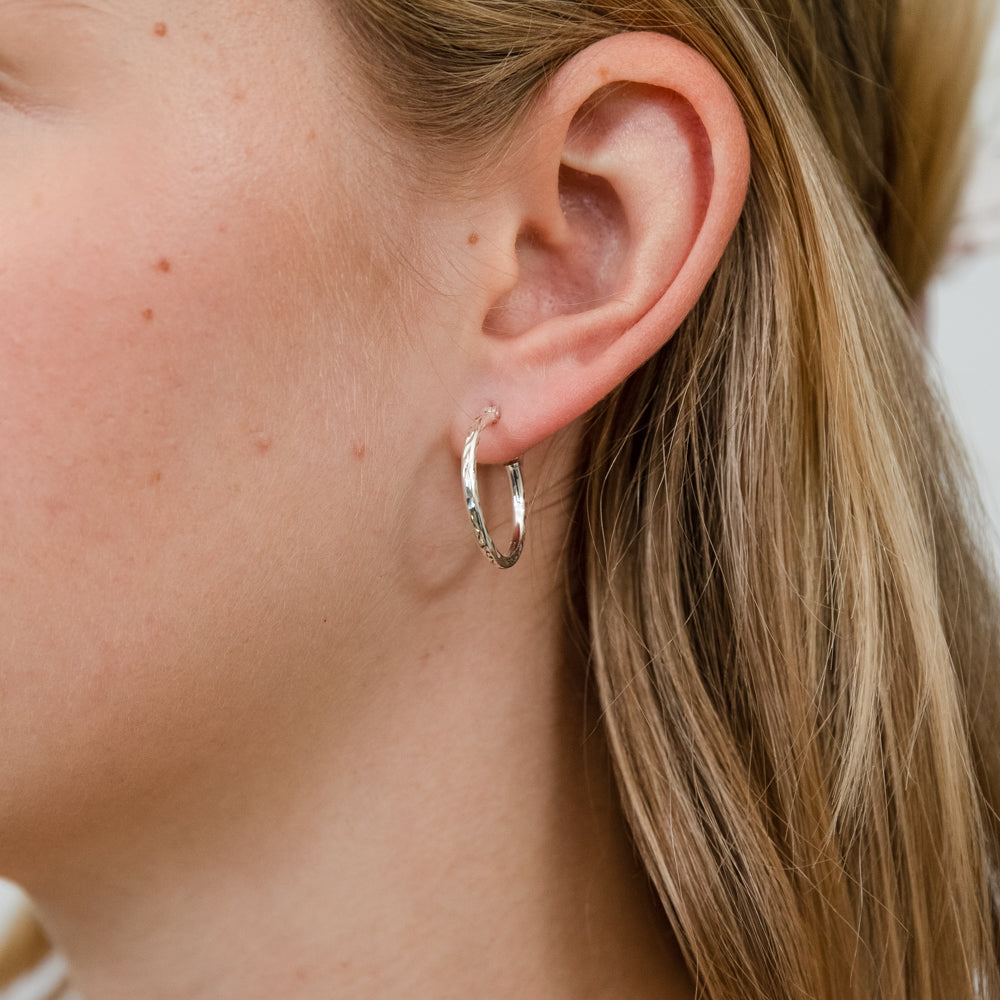 Bevilles 15mm Diamond Cut Oval Hoop Earrings in Sterling Silver main image 0