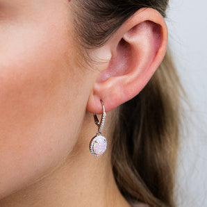 Sterling Silver Rhodium Plated Cubic Zirconia Created Pink Opal Oval Drop Earrings